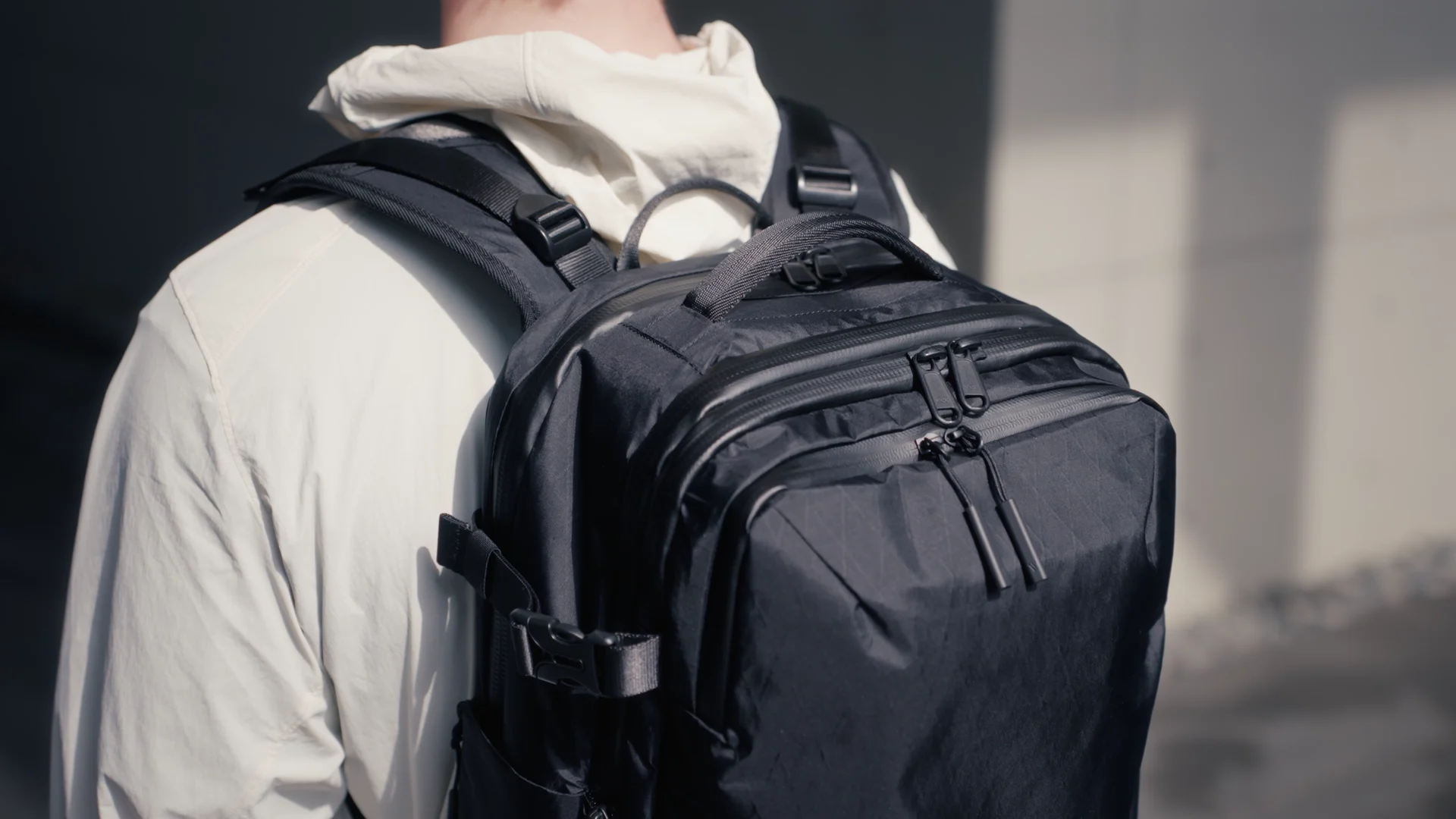 A backpack product film, moving from material and equipment details into the city.