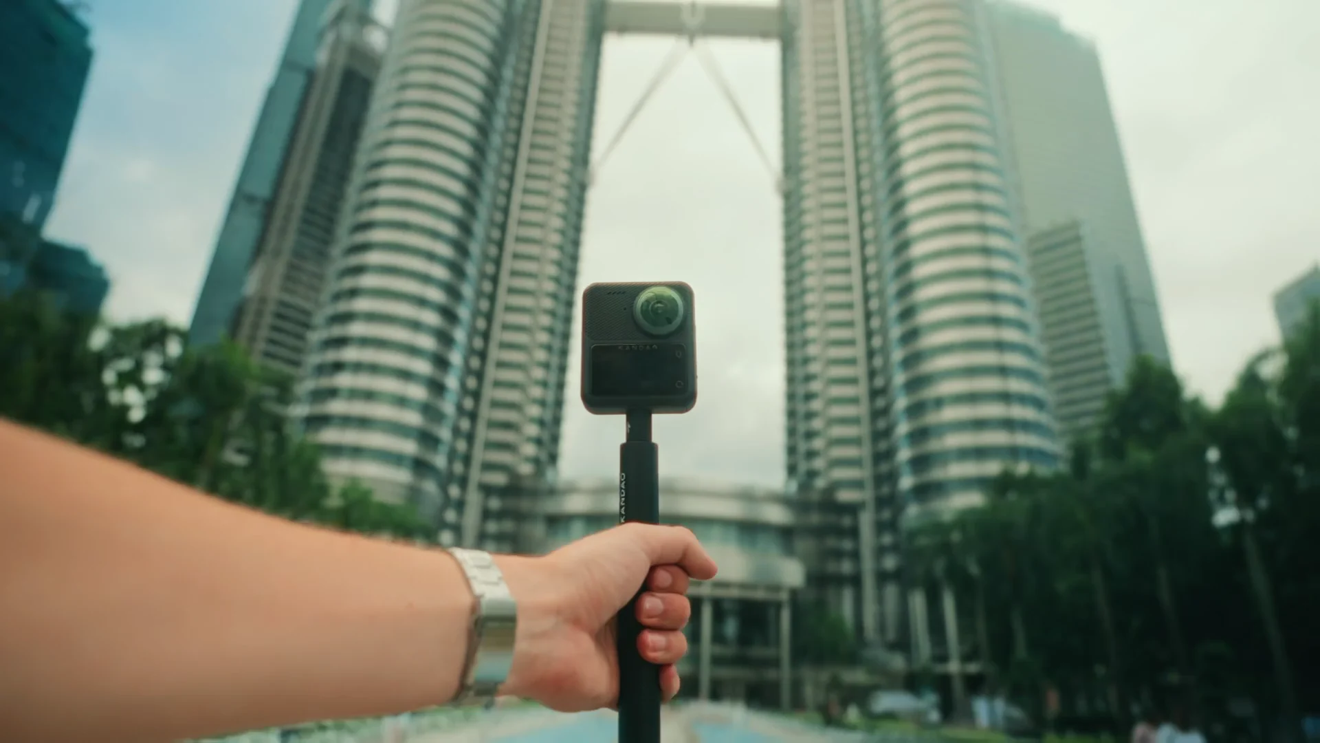 A QooCam 3 product and travel edit through city, water, and open landscapes.